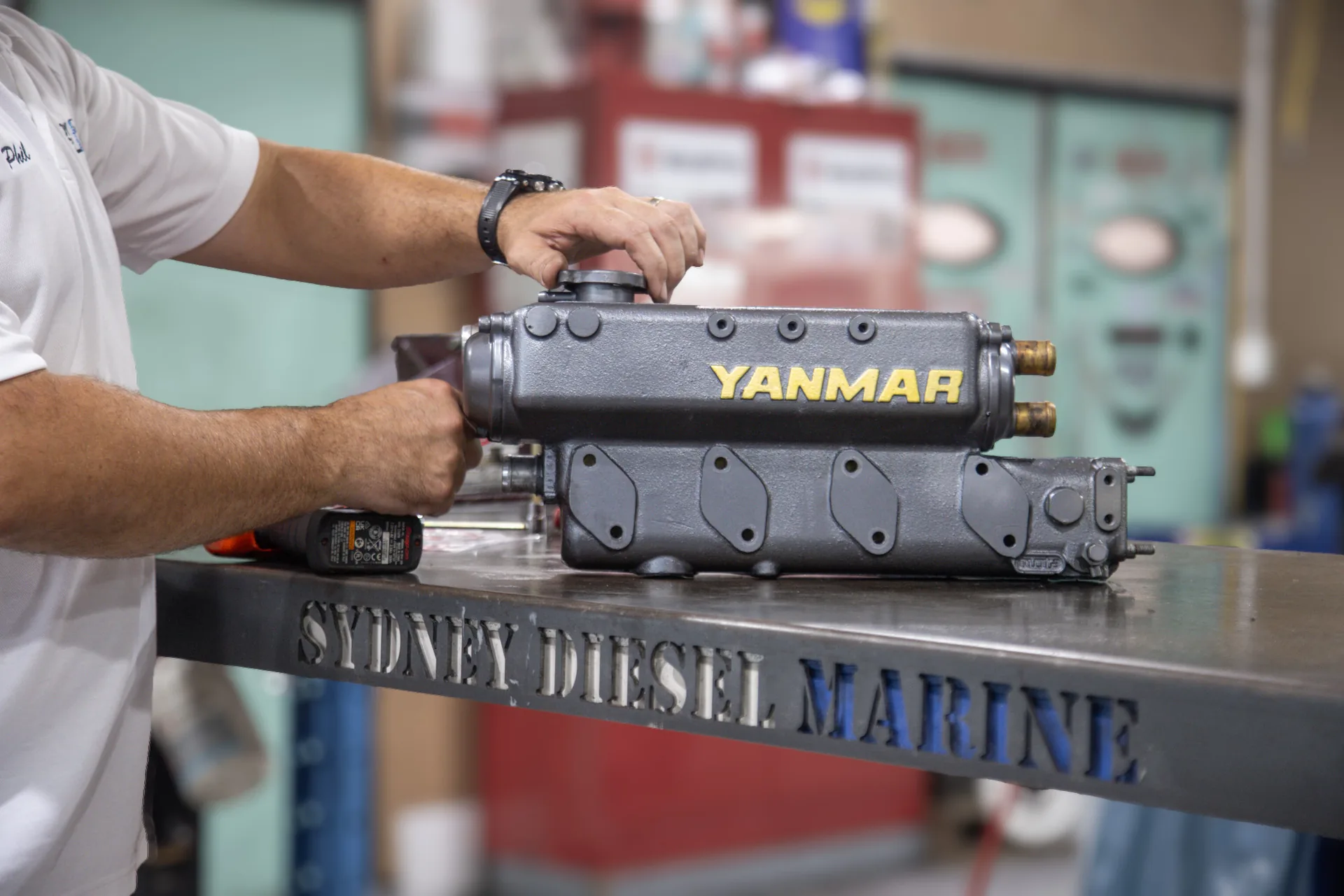 A Yanmar marine diesel cylinder head on the bench at Sydney Diesel Marine