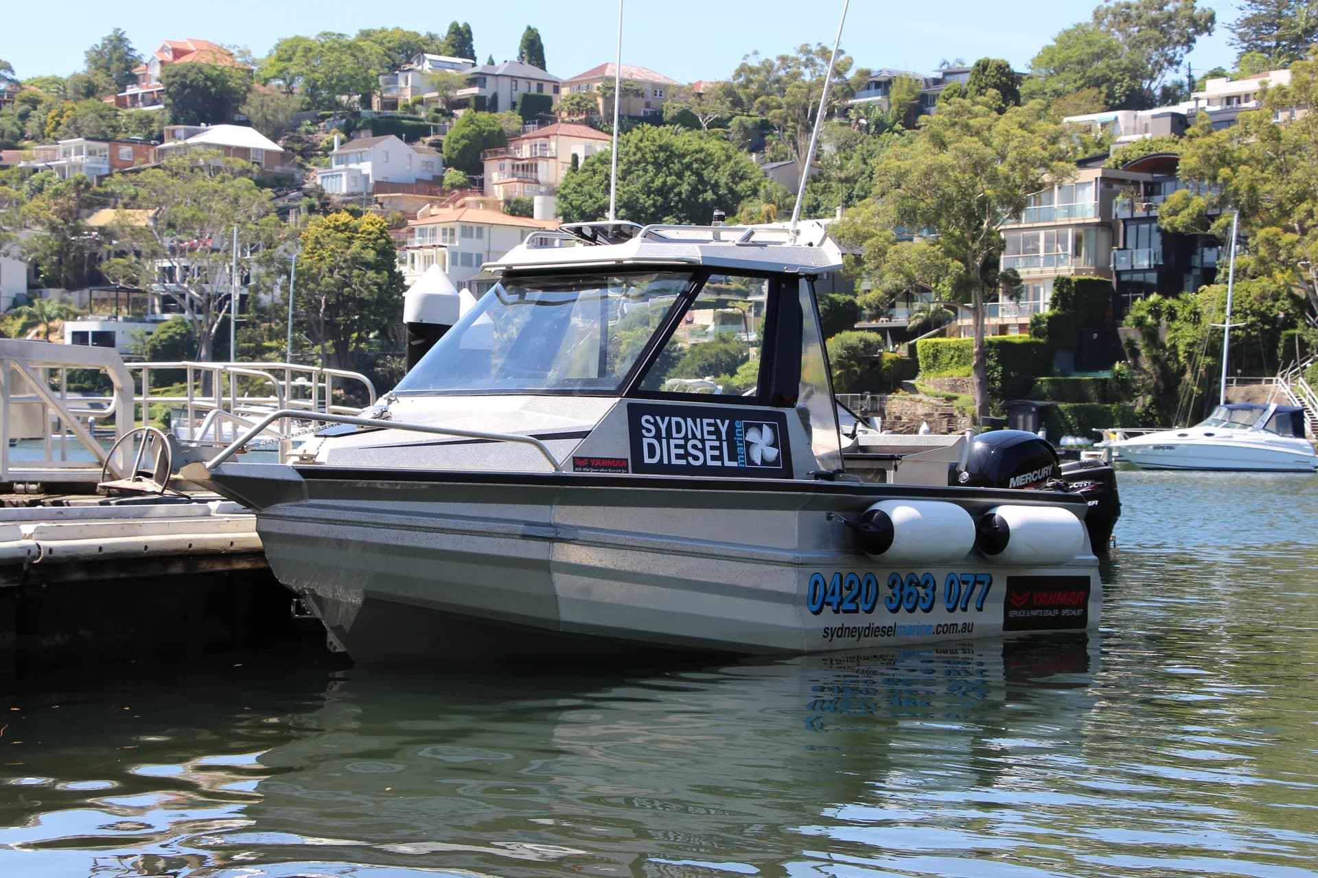 A Sydney Diesel Marine boat at the marina on Sydney Harbour