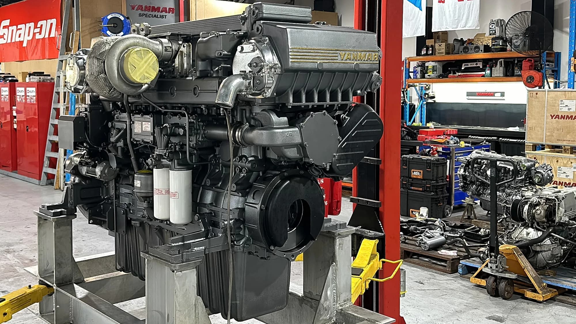 A rebuilt Yanmar marine diesel on a stand in the Sydney Diesel Marine workshop in Artarmon